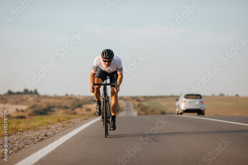 Fototapeta Naklejka Na Ścianę i Meble -  Professional cyclist racing on asphalt road