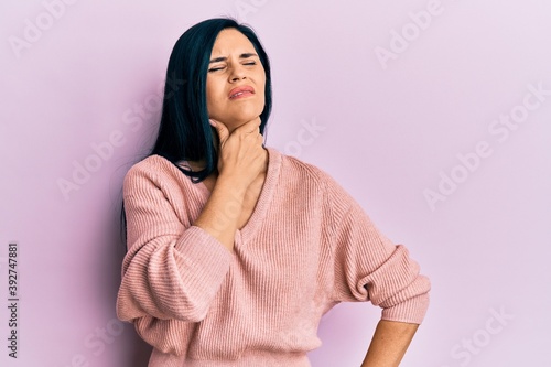 Young caucasian woman wearing casual clothes touching painful neck, sore throat for flu, clod and infection © Krakenimages.com