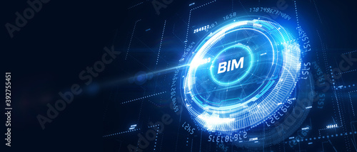 The concept of business, technology, the Internet and the network. A young entrepreneur working on a virtual screen of the future and sees the inscription: BIM