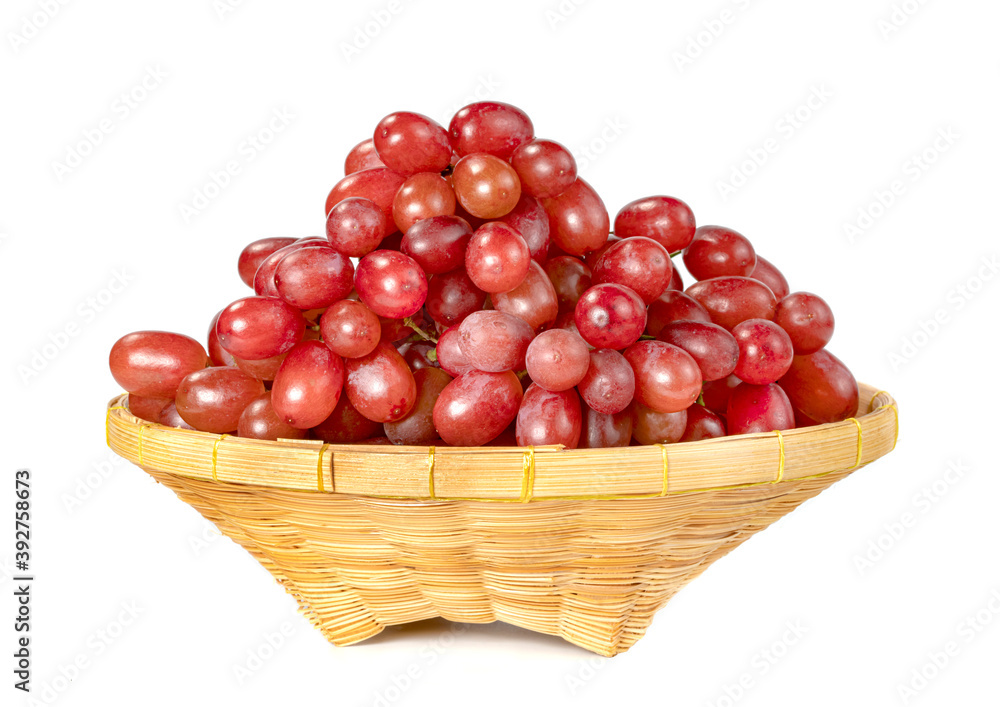 red seedless grapes in the basket isolated on white background red seedless grapes in the basket isolated on white background