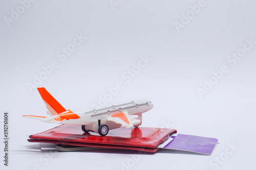 Time to travel. Tourism concept with airplane, boarding tickets and passport.