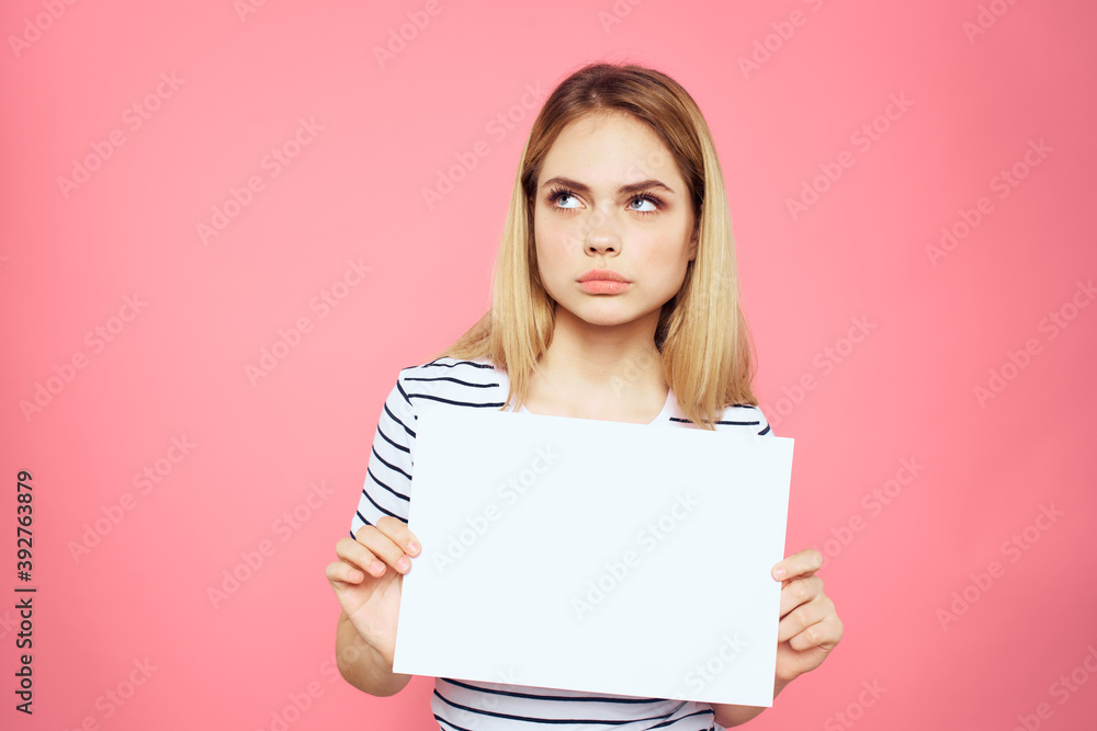 woman holding white sheet in her hands striped t-shirt emotions pink background woman holding white sheet in her hands striped t-shirt emotions pink background