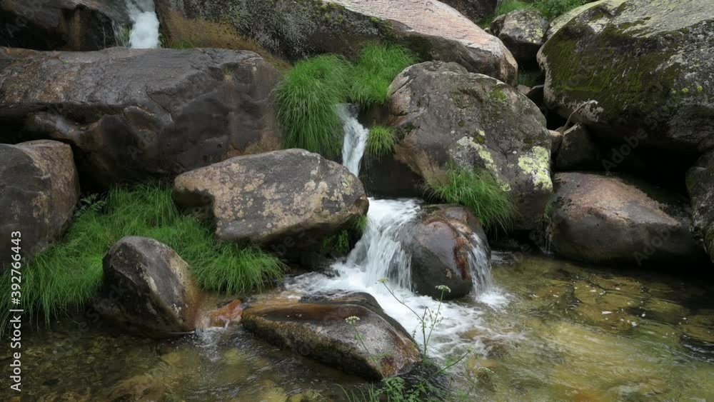 Close up of a mountain stream, passing through the granite rocks. Close up of a mountain stream, passing through the granite rocks.