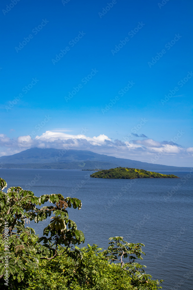 Obraz premium View of Small Islands in the Middle of the Lake Leading to Mombacho Volcano Covered in Clouds from Zapatera Island outside of Granada, Nicaragua