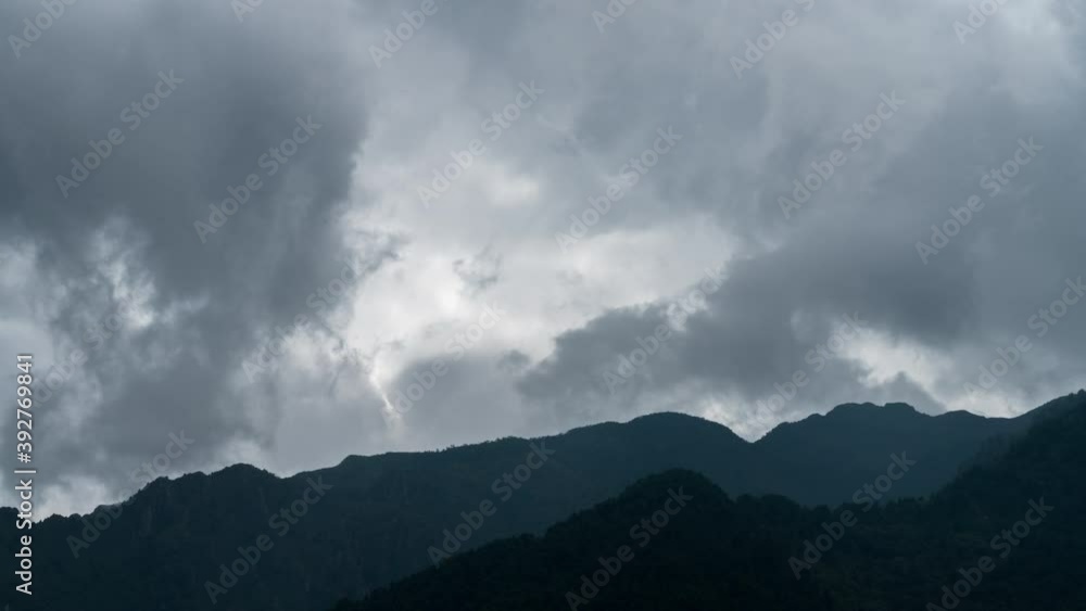 Moody clouds time lapse over Cangshan mountains in Yunnan, China Moody clouds time lapse over Cangshan mountains in Yunnan, China