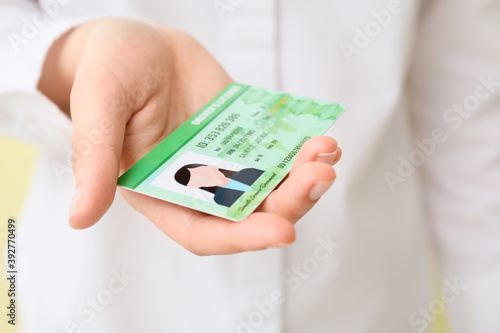 Woman with driving license, closeup