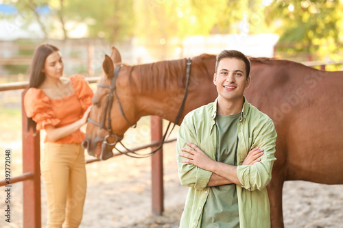 Young couple with cute hors...