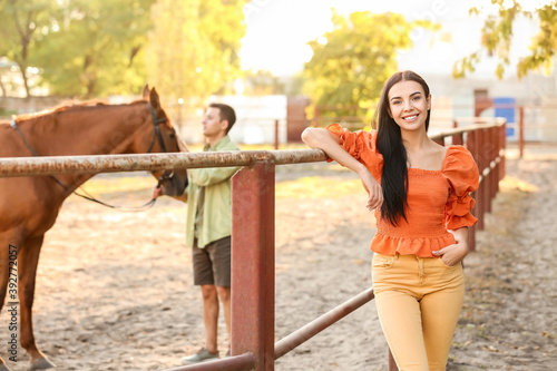 Young couple with cute hors...