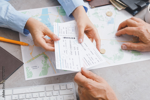 Travel agent giving client ...