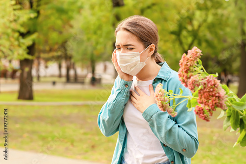 Young woman in medical mask...