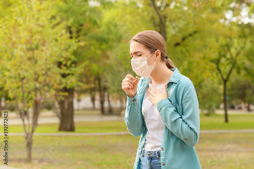 Young woman in medical mask...