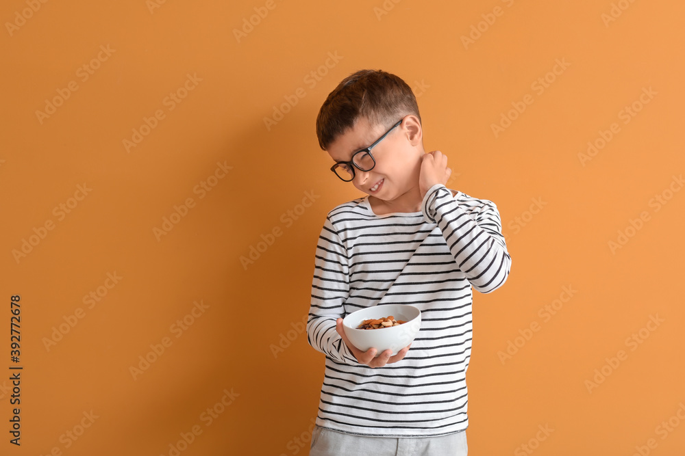 Little boy with food allergy on color background Little boy with food allergy on color background