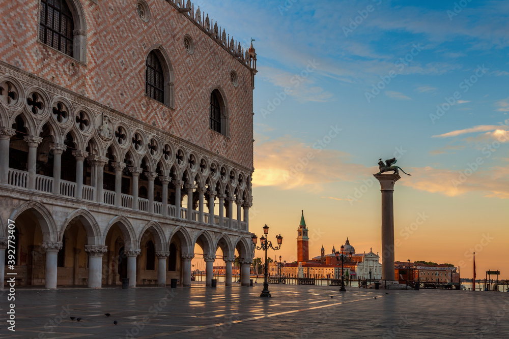 Dawn breaks over the Doges Palace and the island of San Giorgio seen from St. Mark's Square in Venice, Italy