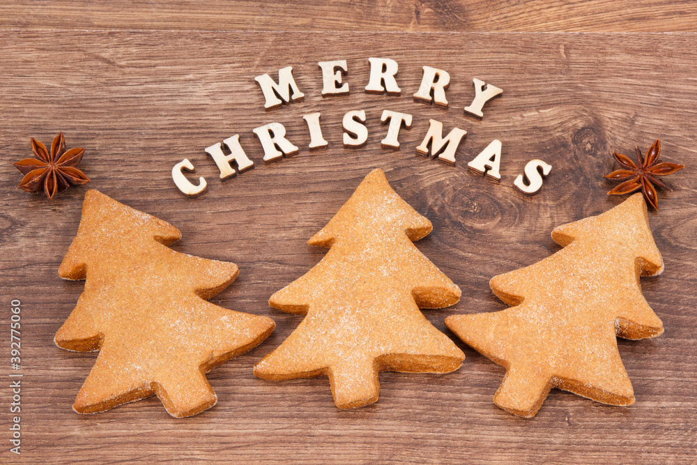 Inscription Merry Christmas with homemade gingerbreads and cookies for festive time Inscription Merry Christmas with homemade gingerbreads and cookies for festive time