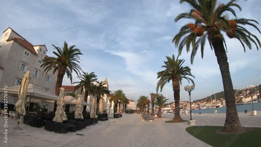 Walking through the beautiful promenade of Trogir town, Croatia Walking through the beautiful promenade of Trogir town, Croatia