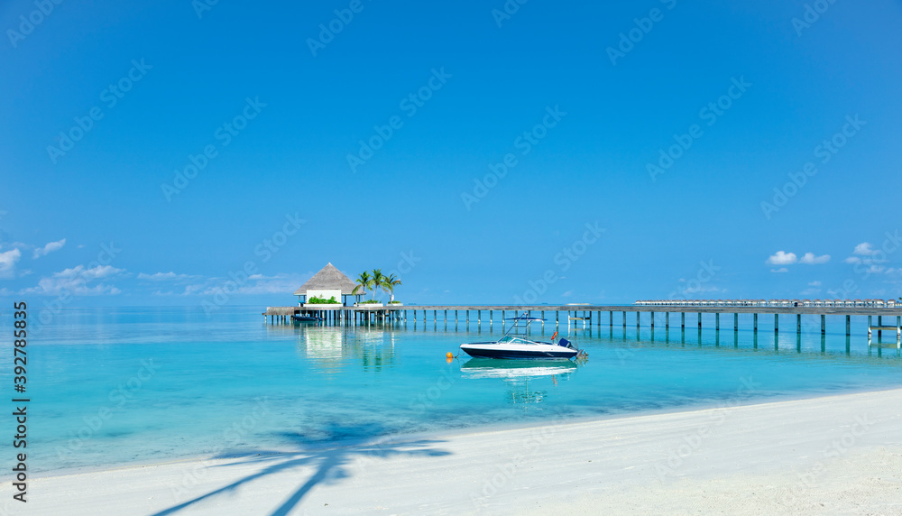 Wooden pier over blue sea water, summer tropical concept