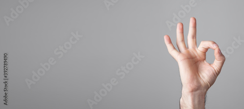 Male hand showing ok gesture. © andranik123