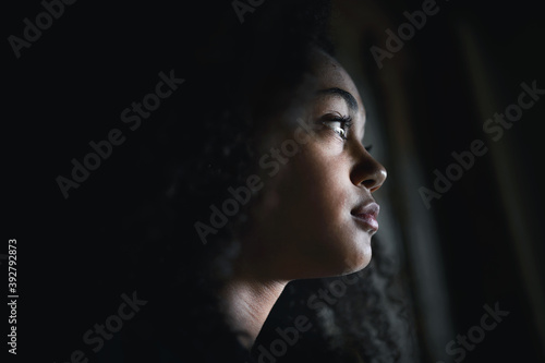 Obraz na plátně Close-up portrait of sad mixed-race teenager girl standing, bullying concept