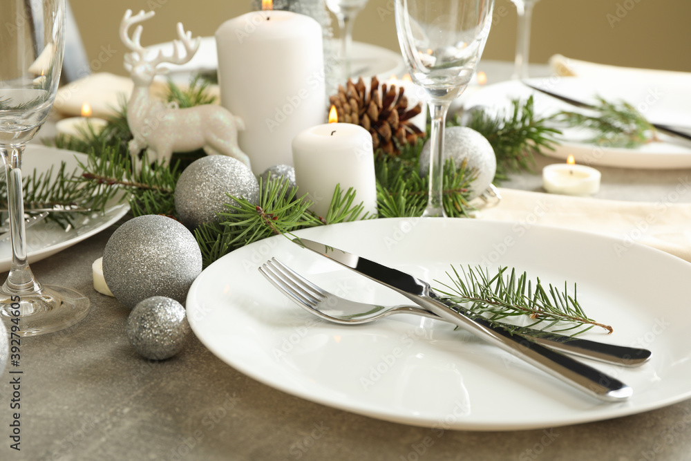 Concept of romantic New year table setting on gray table Concept of romantic New year table setting on gray table