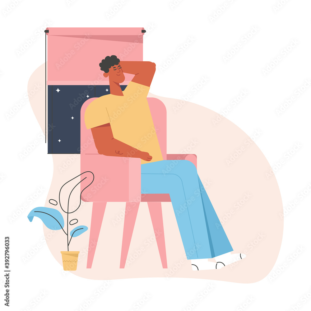 Young guy sitting or sleeping in armchair, relaxing and resting