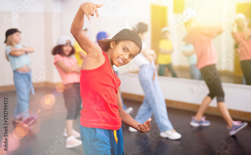 Afro boy hip hop dancer exercising at class. High quality photo