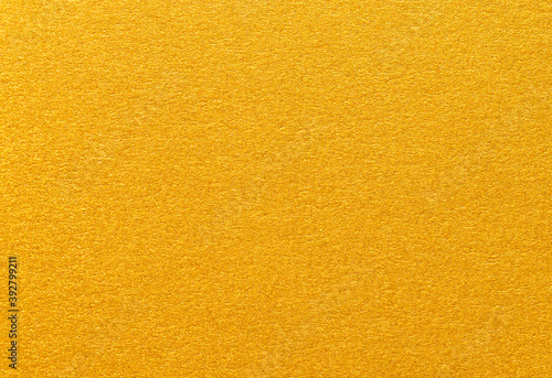 Texture of gold shiny metallic paper