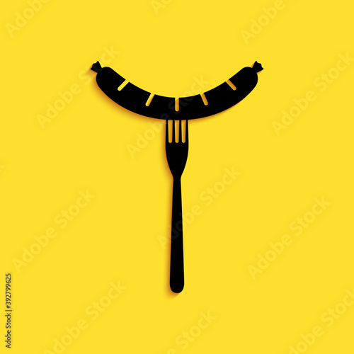 Black Sausage on the fork with steam icon isolated on yellow background. Grilled sausage and aroma sign. Long shadow style. Vector.