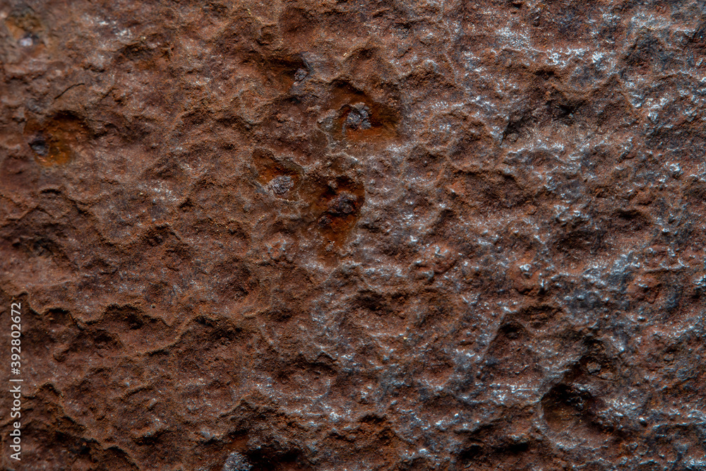 Background with an old metal surface with rust. Photo with soft focus and blurred backdrop at high magnification. Background with an old metal surface with rust. Photo with soft focus and blurred backdrop at high magnification.