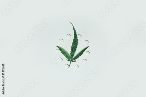 hemp leaf, medical pills with cannabis on white background. Medical marijuana. Concept of herbal alternative medicine, cbd oil, pharmaceptical industry. Copy space