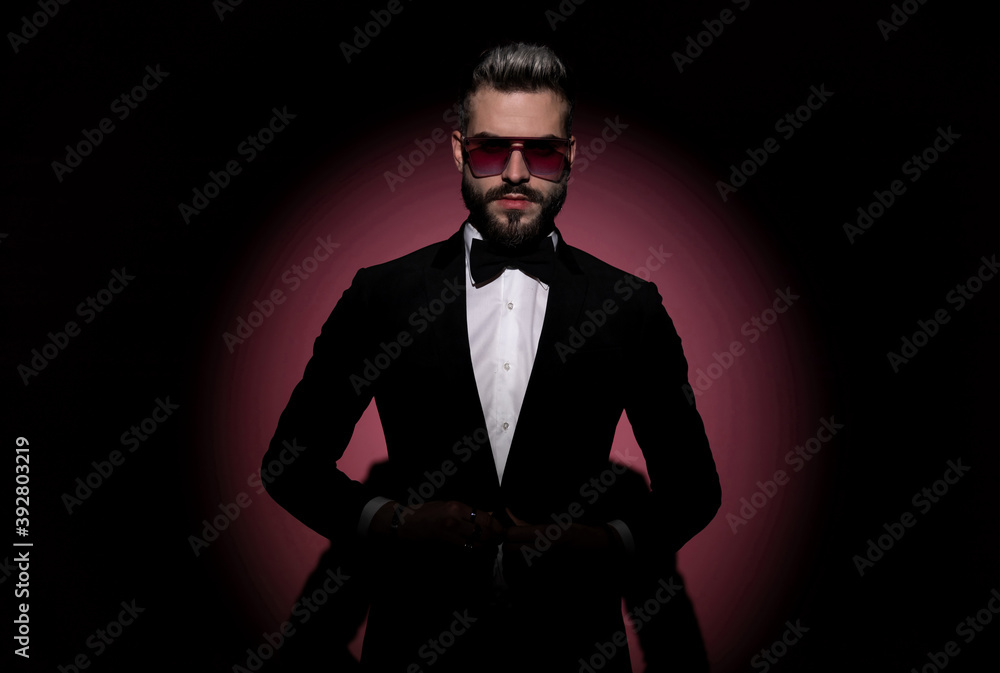 sexy fashion businessman holding hands on his button sexy fashion businessman holding hands on his button
