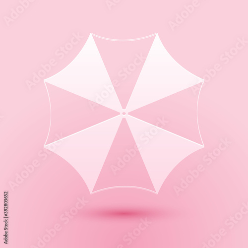 Paper cut Sun protective umbrella fo beach icon isolated on pink background. Large parasol for outdoor space. Summer vacation or picnic accessory. Paper art style. Vector.
