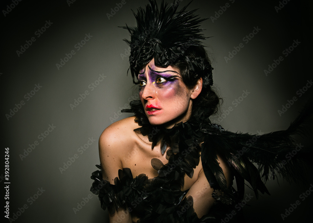 Woman with a 20's cabaret make-up and hair look Woman with a 20's cabaret make-up and hair look