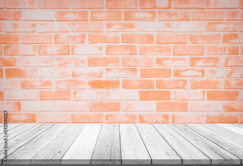 Empty wooden table top on red brick wall background, Design wood terrace white. Perspective for show space for your copy and branding. Can be used as product display montage. Vintage style concept.