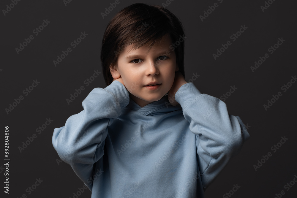 Image of Cute boy 10-12 years old smiling and looking at camera. Studio shot, gray background Image of Cute boy 10-12 years old smiling and looking at camera. Studio shot, gray background