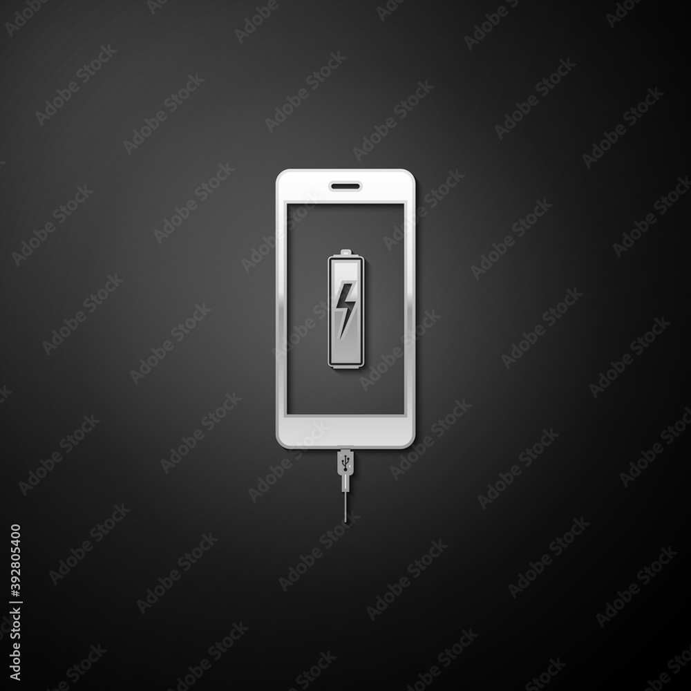 Silver Smartphone battery charge icon isolated on black background. Phone with a low battery charge and with USB connection. Long shadow style. Vector. Silver Smartphone battery charge icon isolated on black background. Phone with a low battery charge and with USB connection. Long shadow style. Vector.