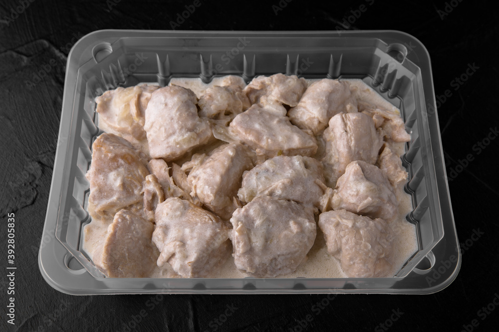 Chicken fillet in a creamy sauce with mushrooms and onions, ready to eat, vacuum packed. Semi-finished product for restaurant and home. Food delivery. Chicken fillet in a creamy sauce with mushrooms and onions, ready to eat, vacuum packed. Semi-finished product for restaurant and home. Food delivery.