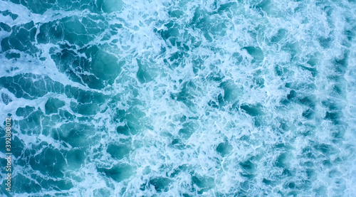 Seascape. Nice sea background. Aerial top view of waves, foam, water, ocean.