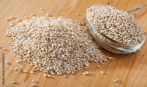 Pearl barley on a wooden surface, macro. High quality photo
