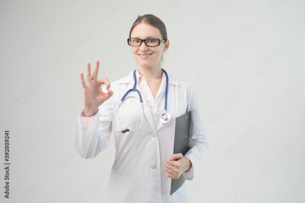 Portrait of an attractive young female doctor in white coat. Portrait of an attractive young female doctor in white coat.