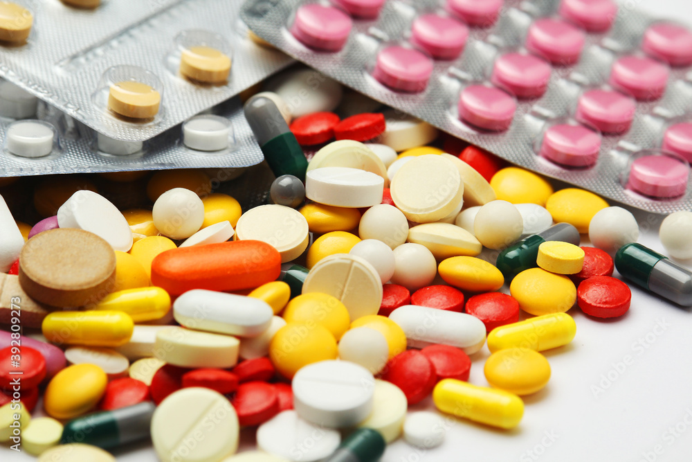 Different colorful tablets at white background Different colorful tablets at white background