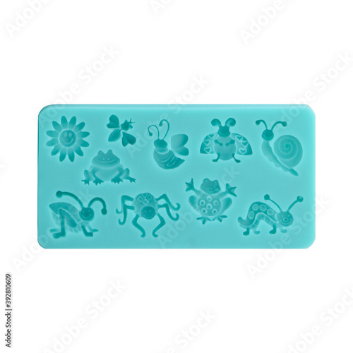 Blue silicone form isolated on white background. Silicone mold, bakeware. Top view, flat lay