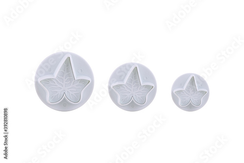 Plastic cutter for mastic shaped as leaf isolated on white background. Mold  bakeware. Top view  flat lay