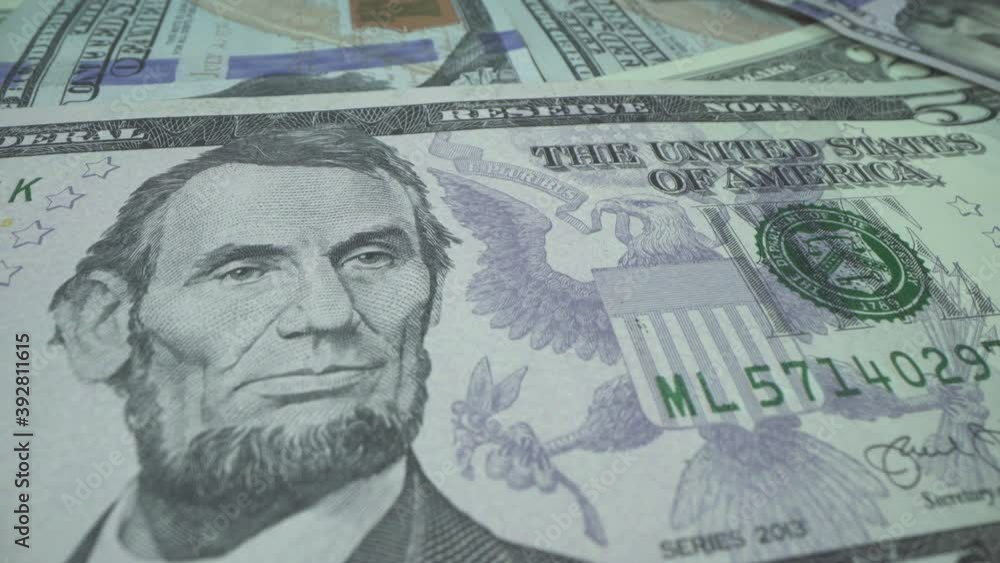 USD banknote. 5 dollars USA in Macro shot. President of the United ...