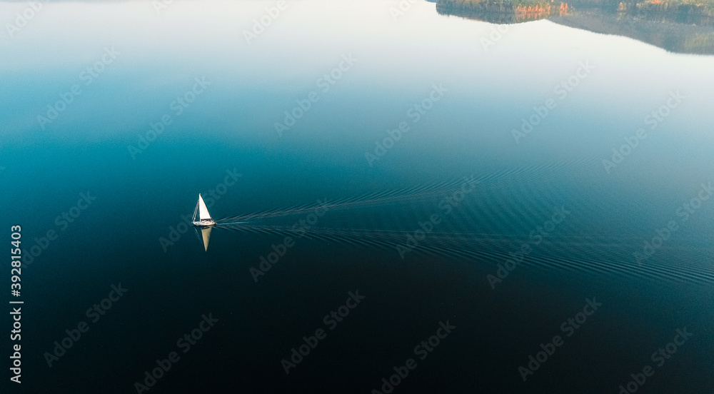 Yacht in blue lake in the evening with amazing background- beautiful blue sky Yacht in blue lake in the evening with amazing background- beautiful blue sky