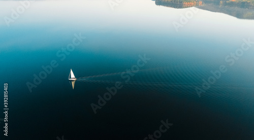 Yacht in blue lake in the evening with amazing background- beautiful blue sky