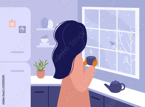 Woman standing in kitchen looking out window. Girl drinking hot tea or coffee at home, watching on winter landscape outside. Time for yourself, relax, slow down concept. Life style vector illustration