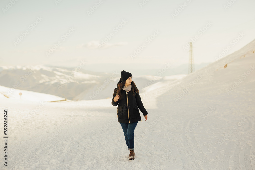 Girl on high of the snowy mountains. Landscape with snow in Italy with copy space. Girl on high of the snowy mountains. Landscape with snow in Italy with copy space.