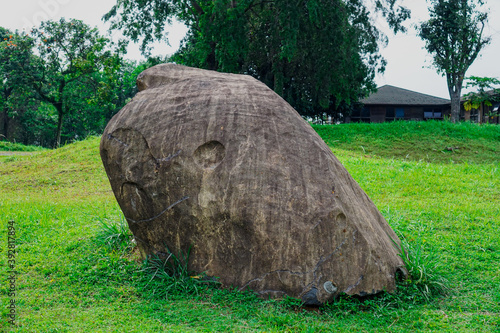 Big old stone on the grass