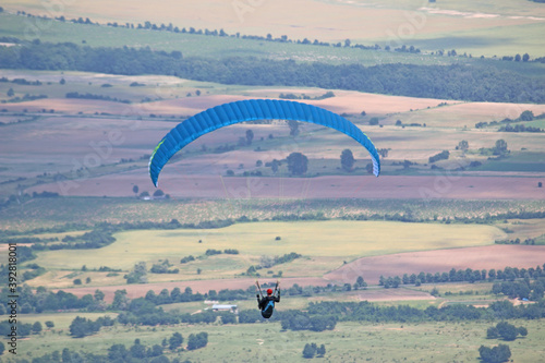 Paraglider flying from Dobrostan in Bulgaria 