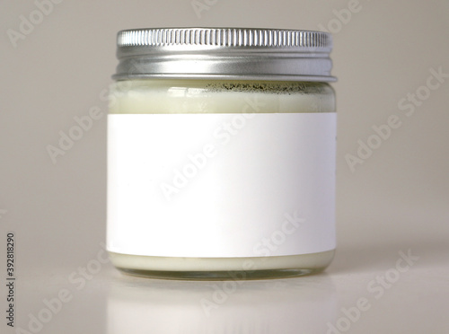Glass jar packaging with metal lid and white label